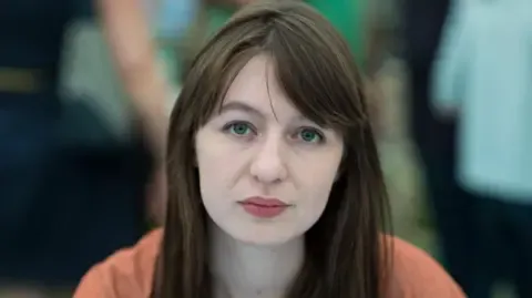 Sally Rooney claims she will not visit the UK over potential arrest