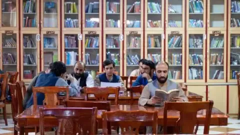 Afghanistan's rulers prohibit textbooks written by female authors from the nation's colleges